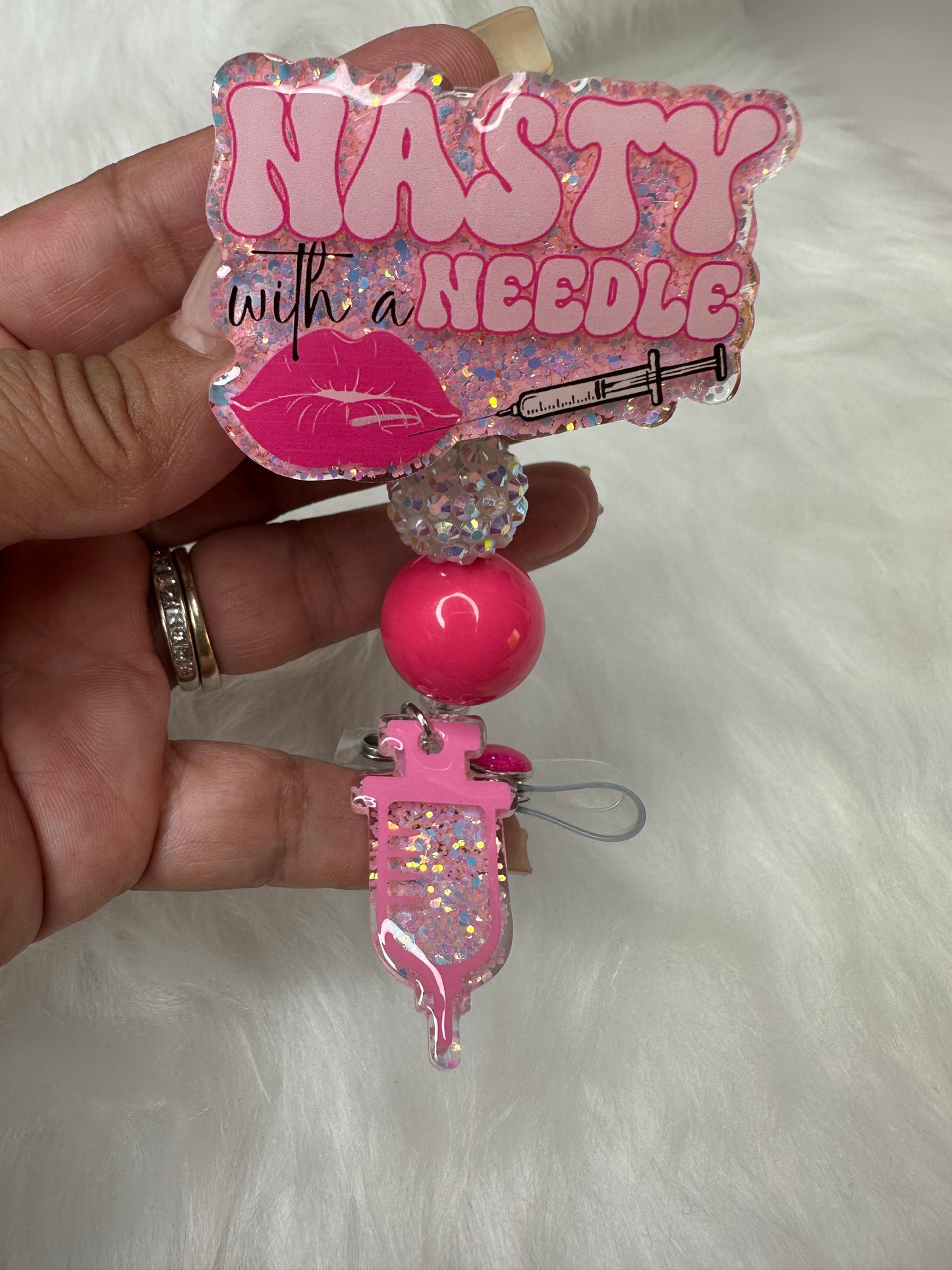 NASTY With a Needle Badge Reel