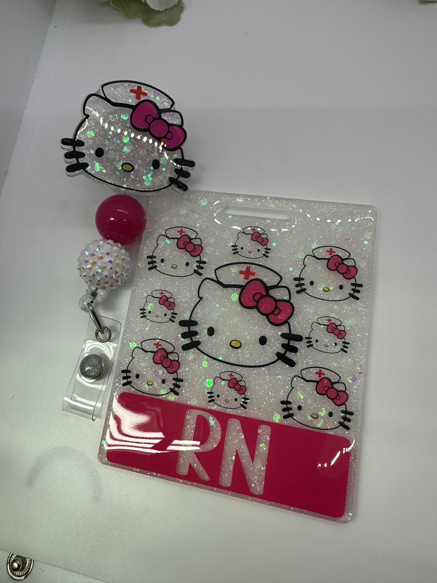 Extended Kitty Nurse badge Buddy Reel Set is an excellent accessory to your scrubs, shirt pocket, belt loop, lanyard and more. They make super fun and useful gifts for any person in any profession. A great gift choice for nurses, medical staff, office staff, and anyone who is required to wear a badge!