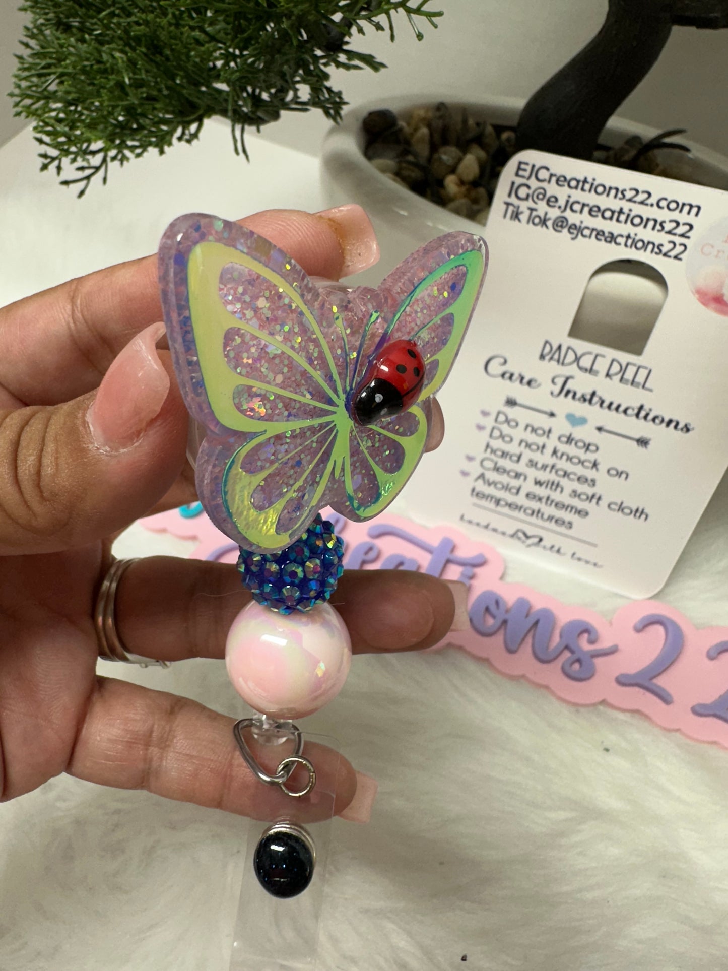 Butterfly with Ladybug Badge Reel