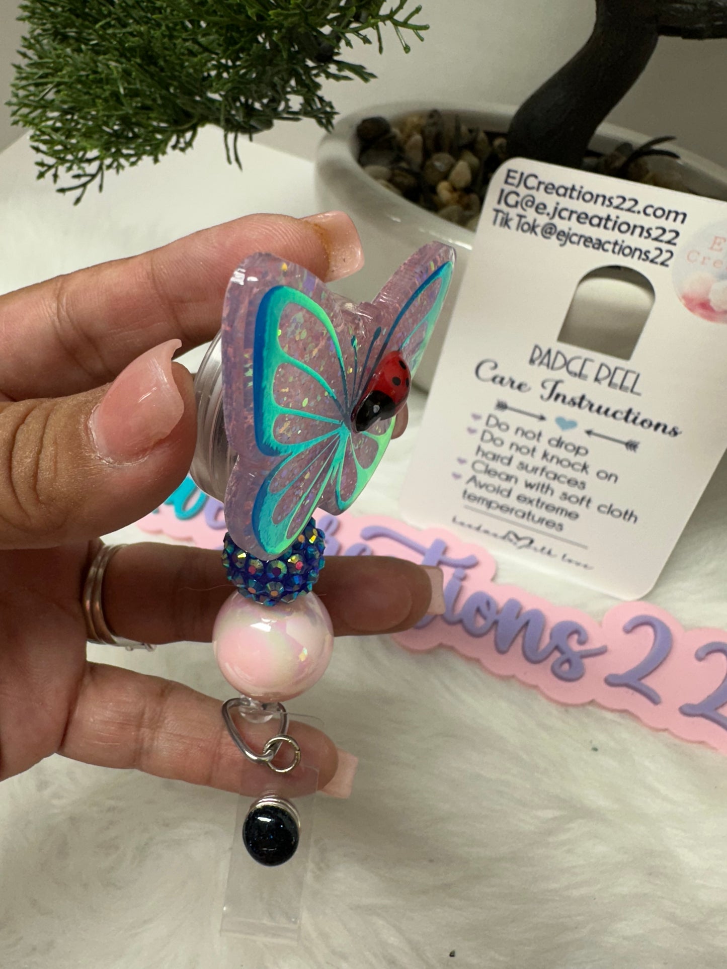 Butterfly with Ladybug Badge Reel
