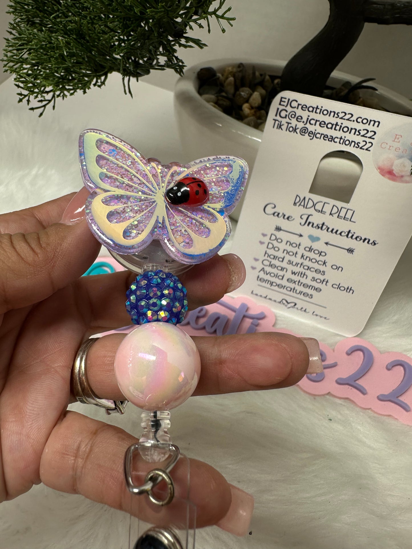 Butterfly with Ladybug Badge Reel