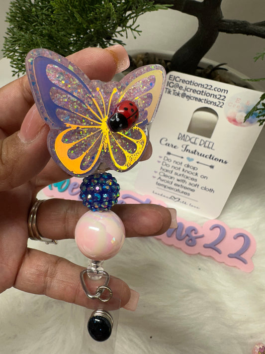 Butterfly with Ladybug Badge Reel