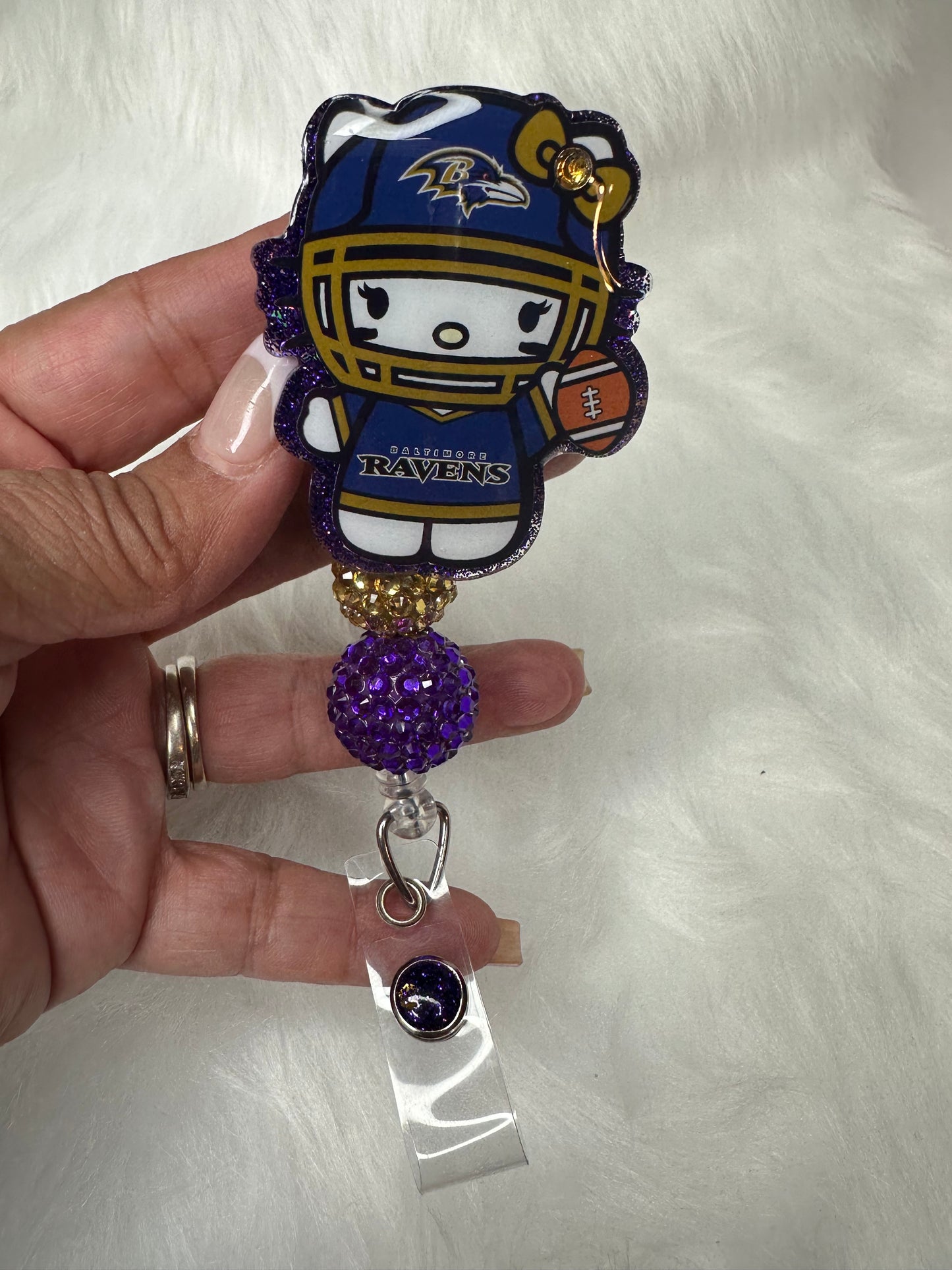 Kitty Football Purple/Gold Badge Reel