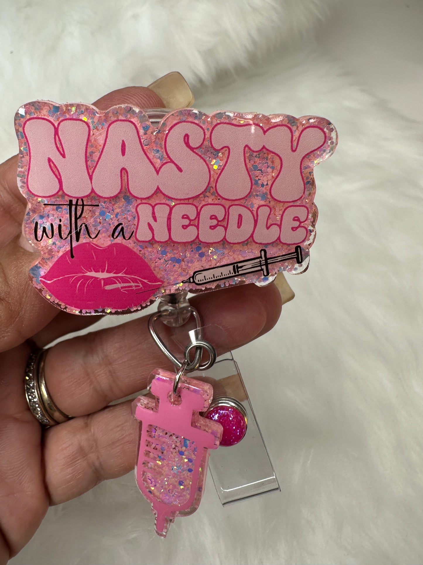 NASTY With a Needle Badge Reel