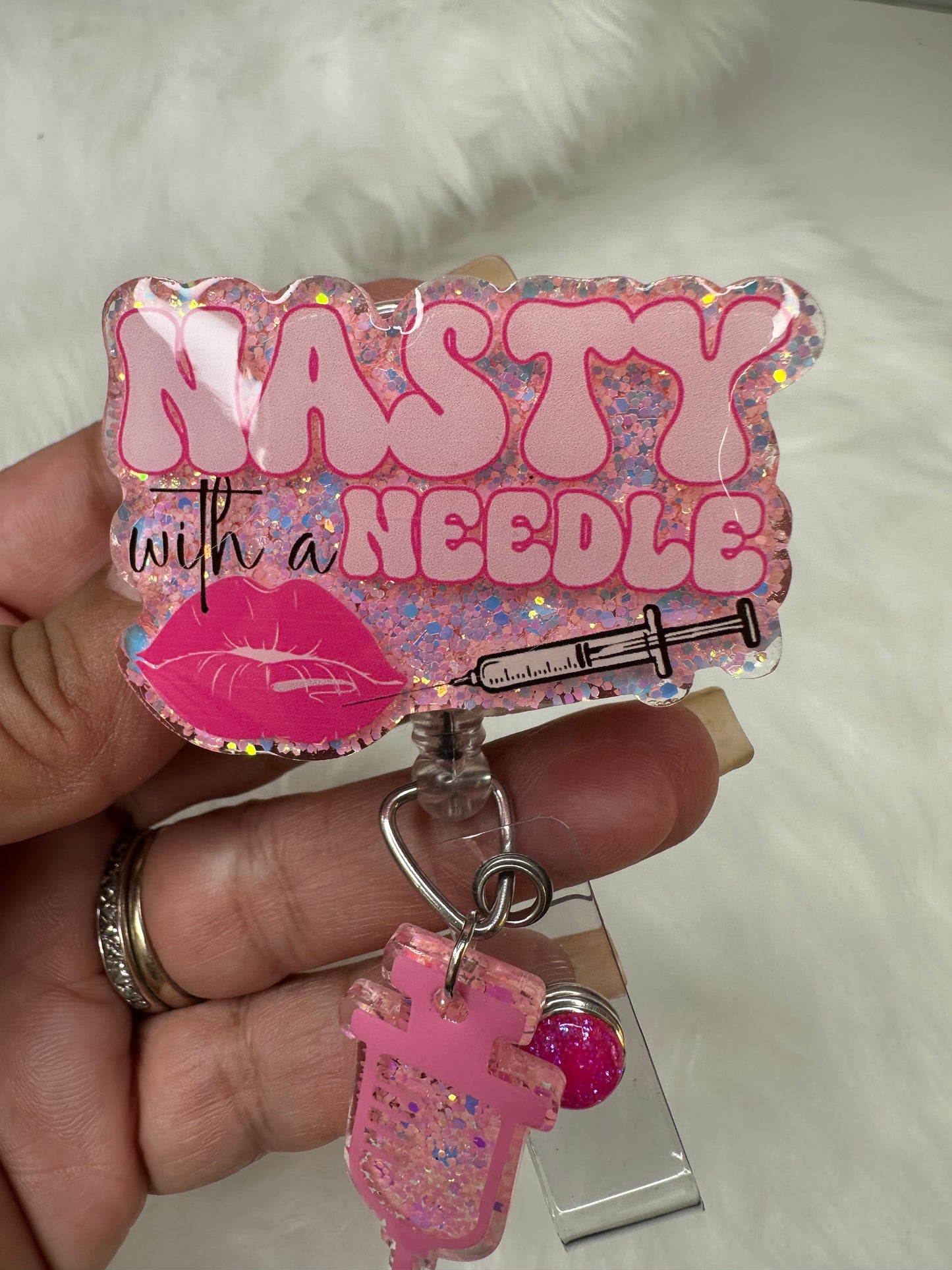NASTY With a Needle Badge Reel