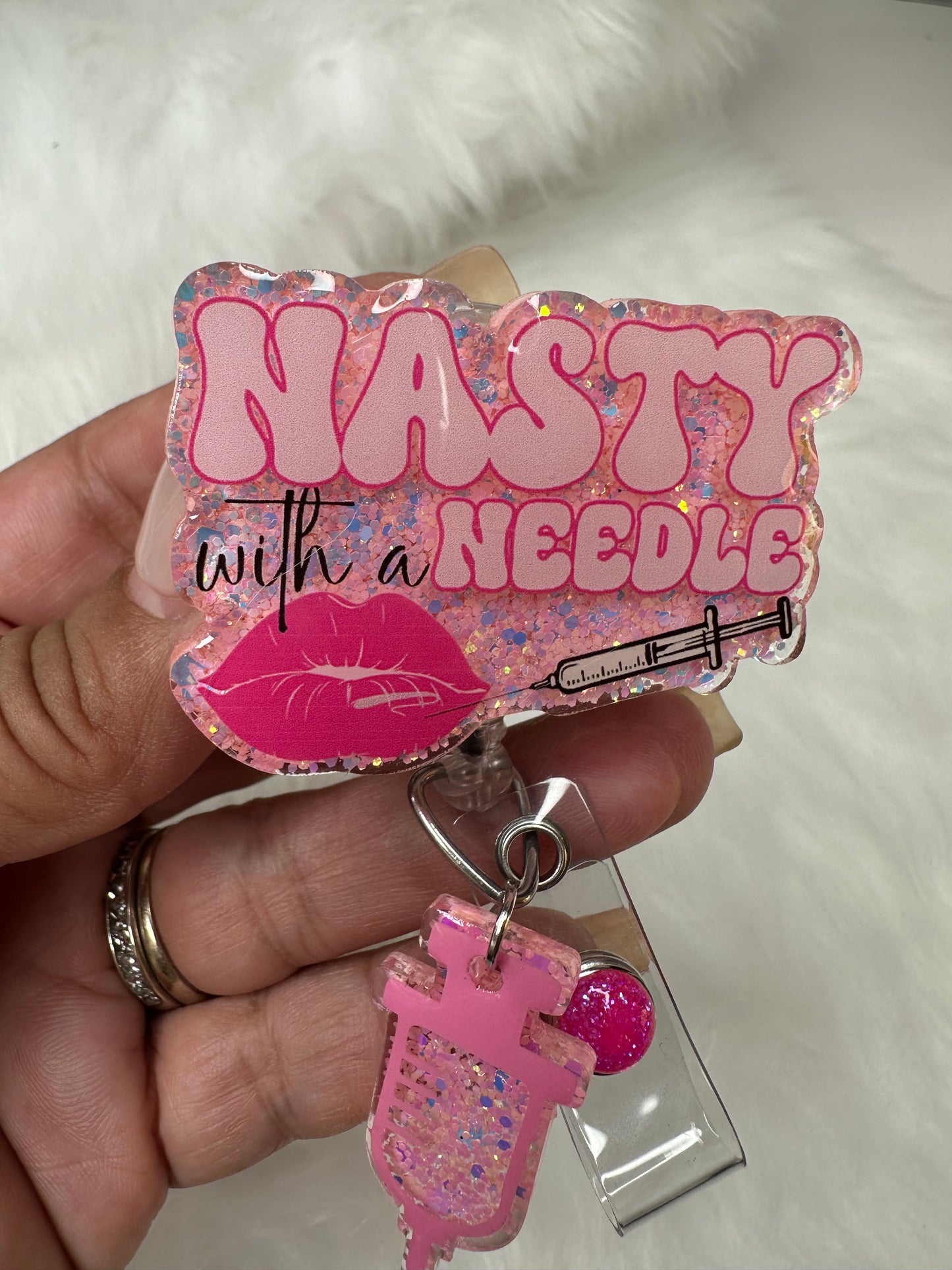 NASTY With a Needle Badge Reel