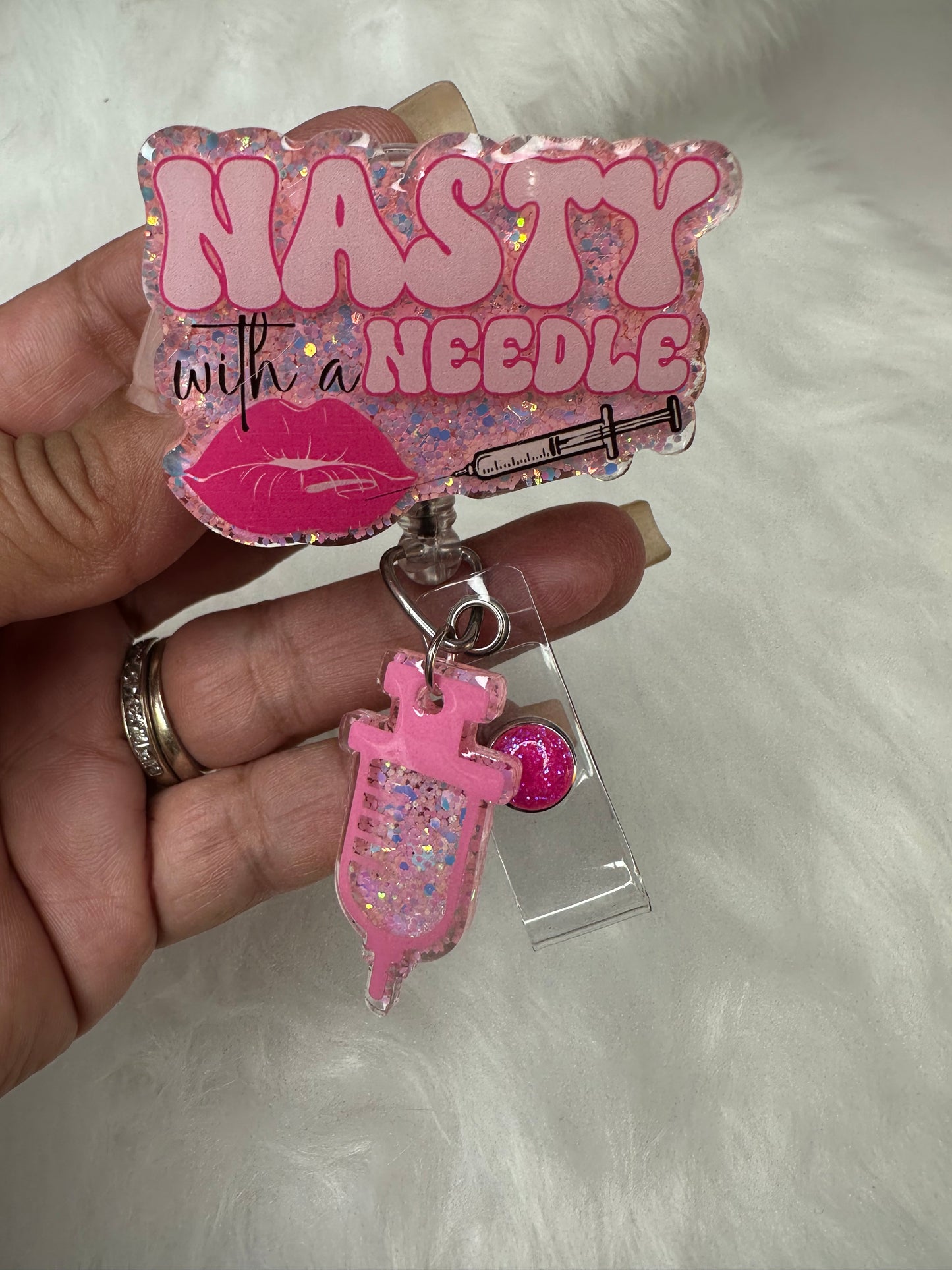 NASTY With a Needle Badge Reel