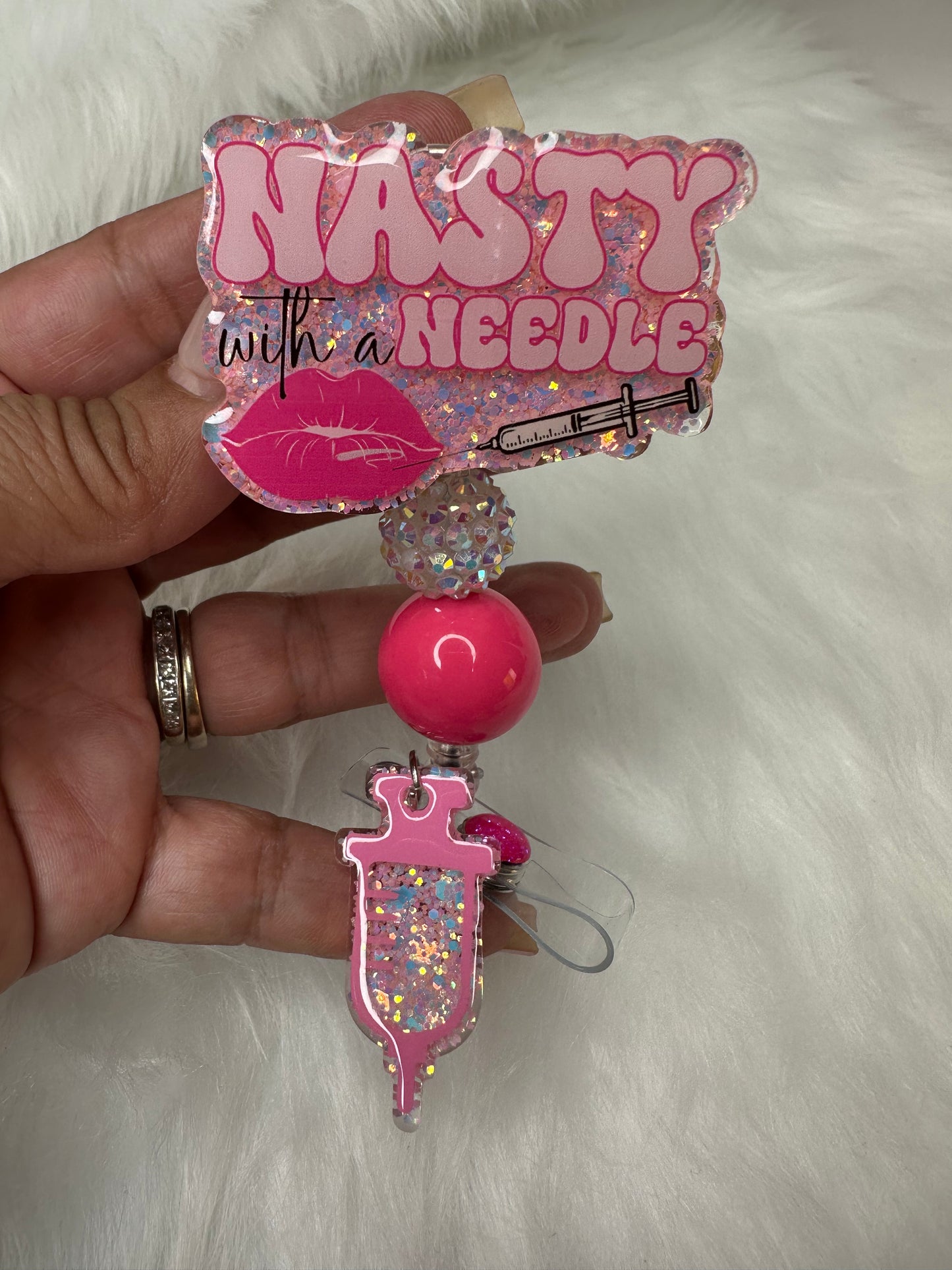 NASTY With a Needle Badge Reel