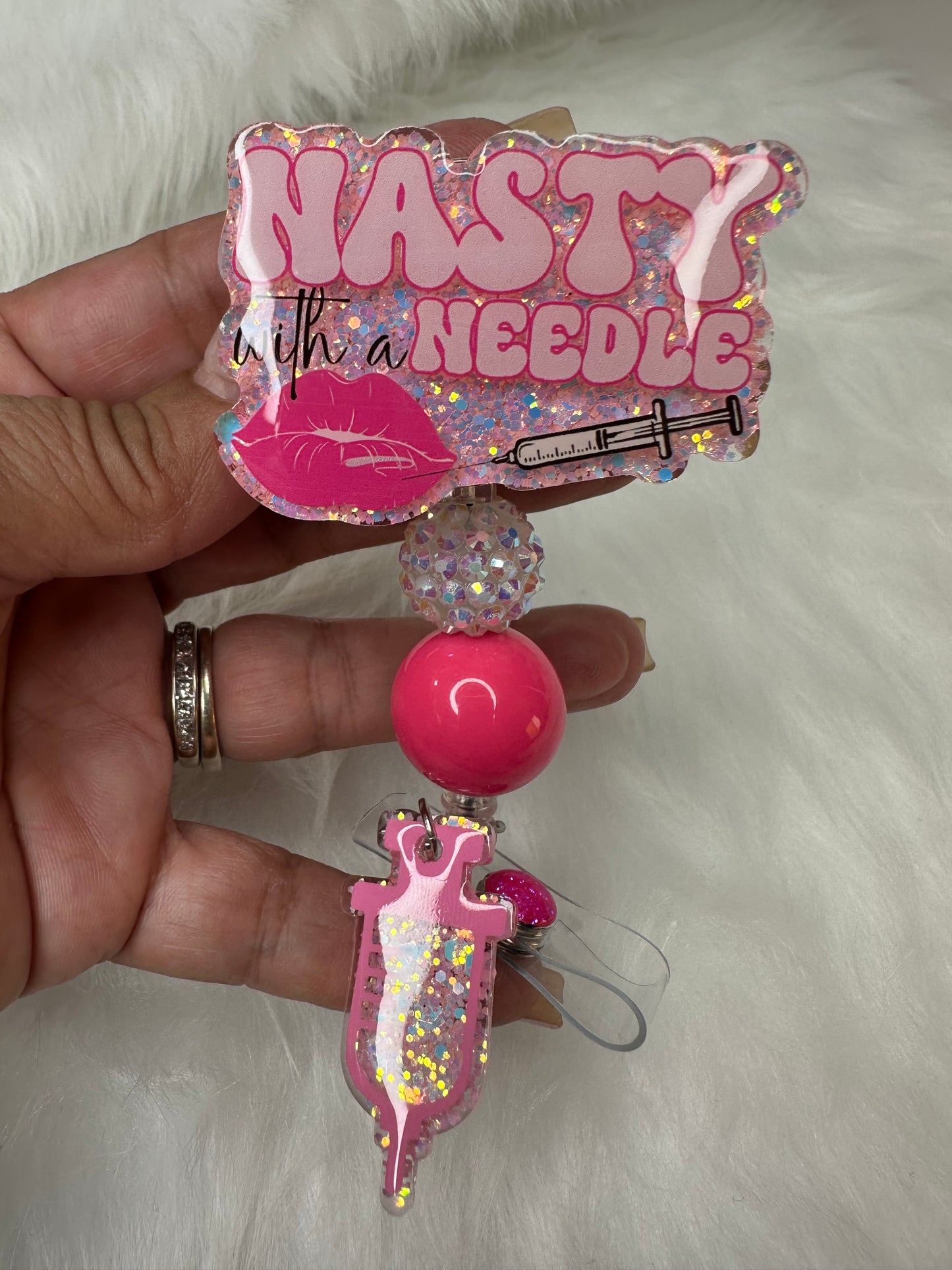 NASTY With a Needle Badge Reel