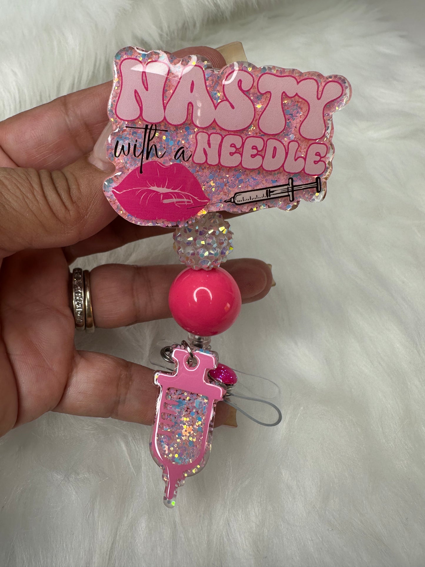 NASTY With a Needle Badge Reel