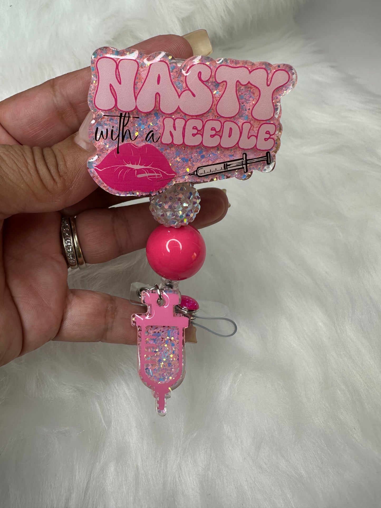 NASTY With a Needle Badge Reel