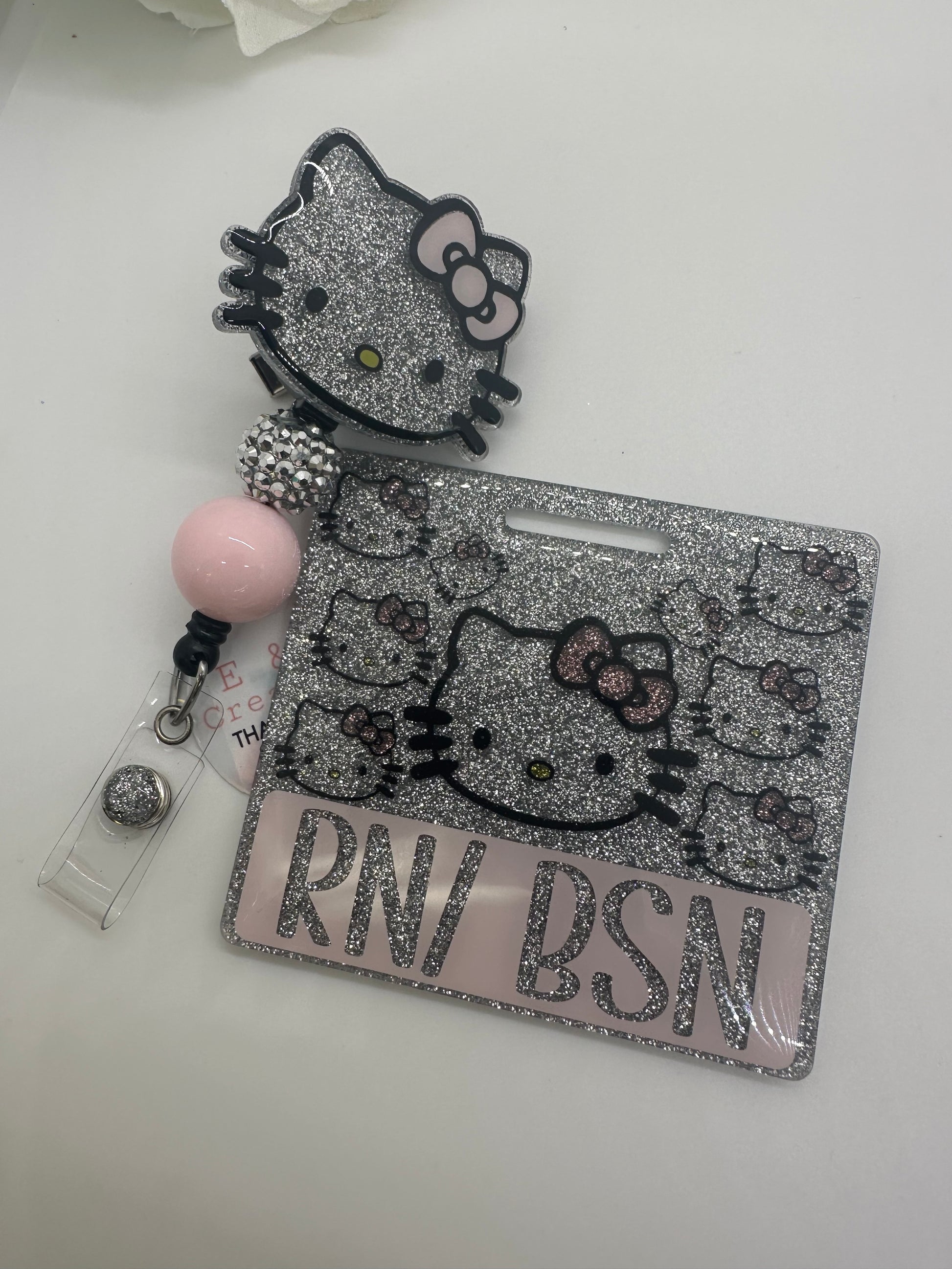 Light Pink Silver Kitty badge buddy set is an excellent  accessory to your scrubs, shirt pocket, belt loop, lanyard and more.  They make super fun and useful gifts for any person in any profession.  A great gift choice for nurses, medical staff, office staff, and anyone who is required to wear a badge!