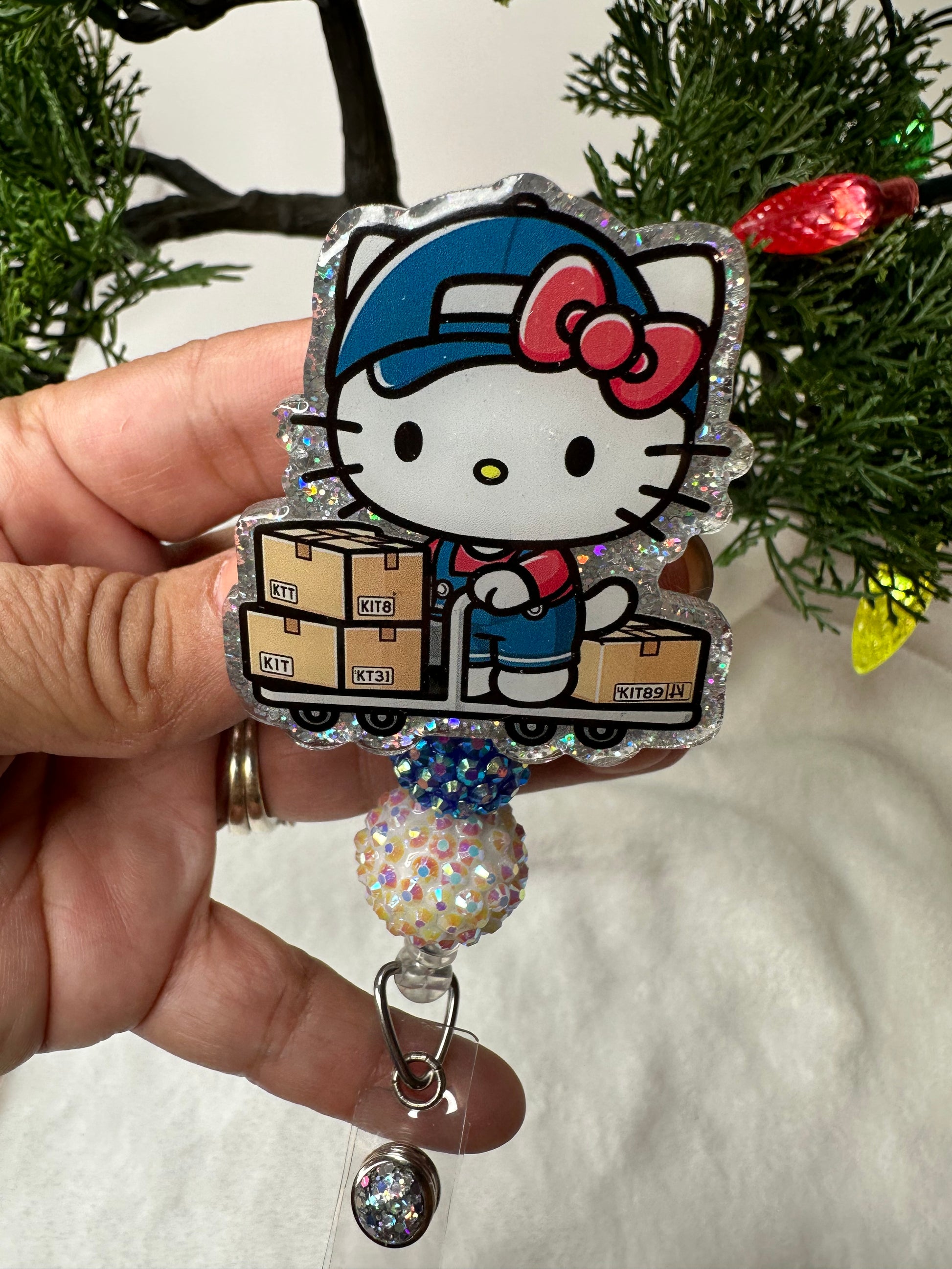 hello kitty warehouse badge reel 