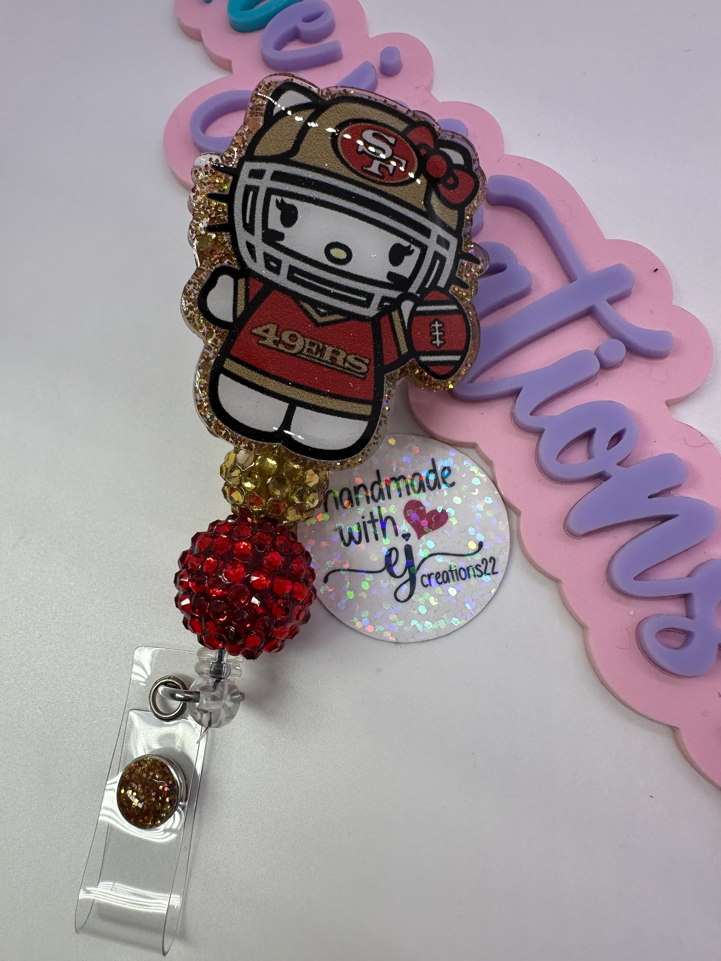 Kitty Red & Gold Badge Reel