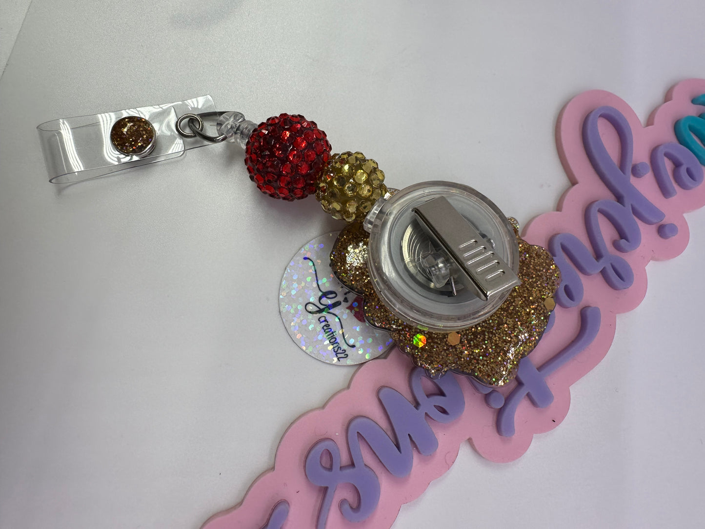 Kitty Red & Gold Badge Reel