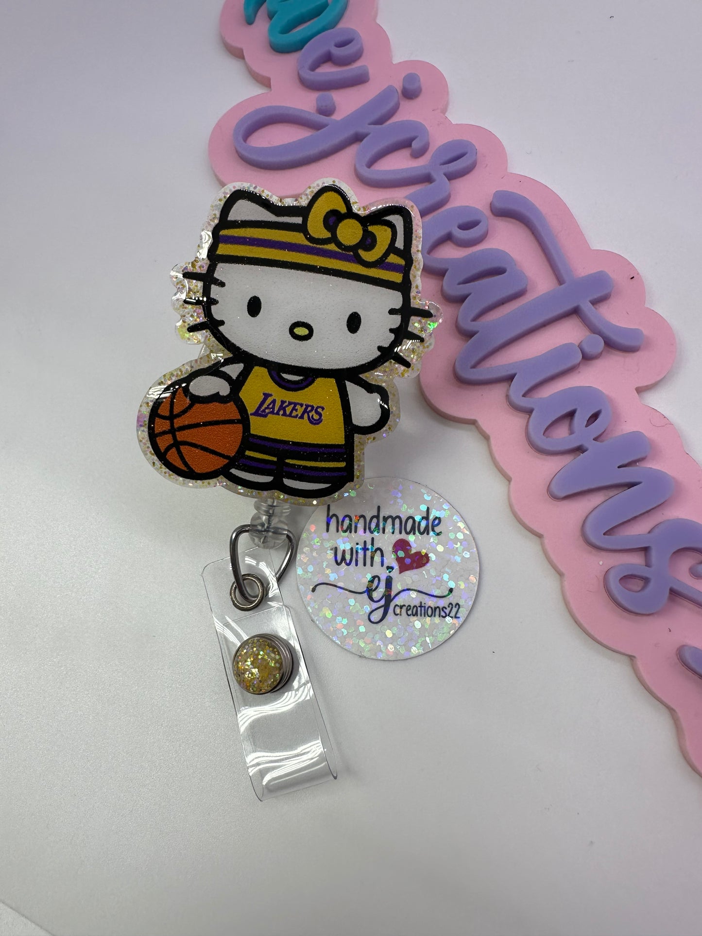 Kitty Basketball Purple & Gold Badge Reel