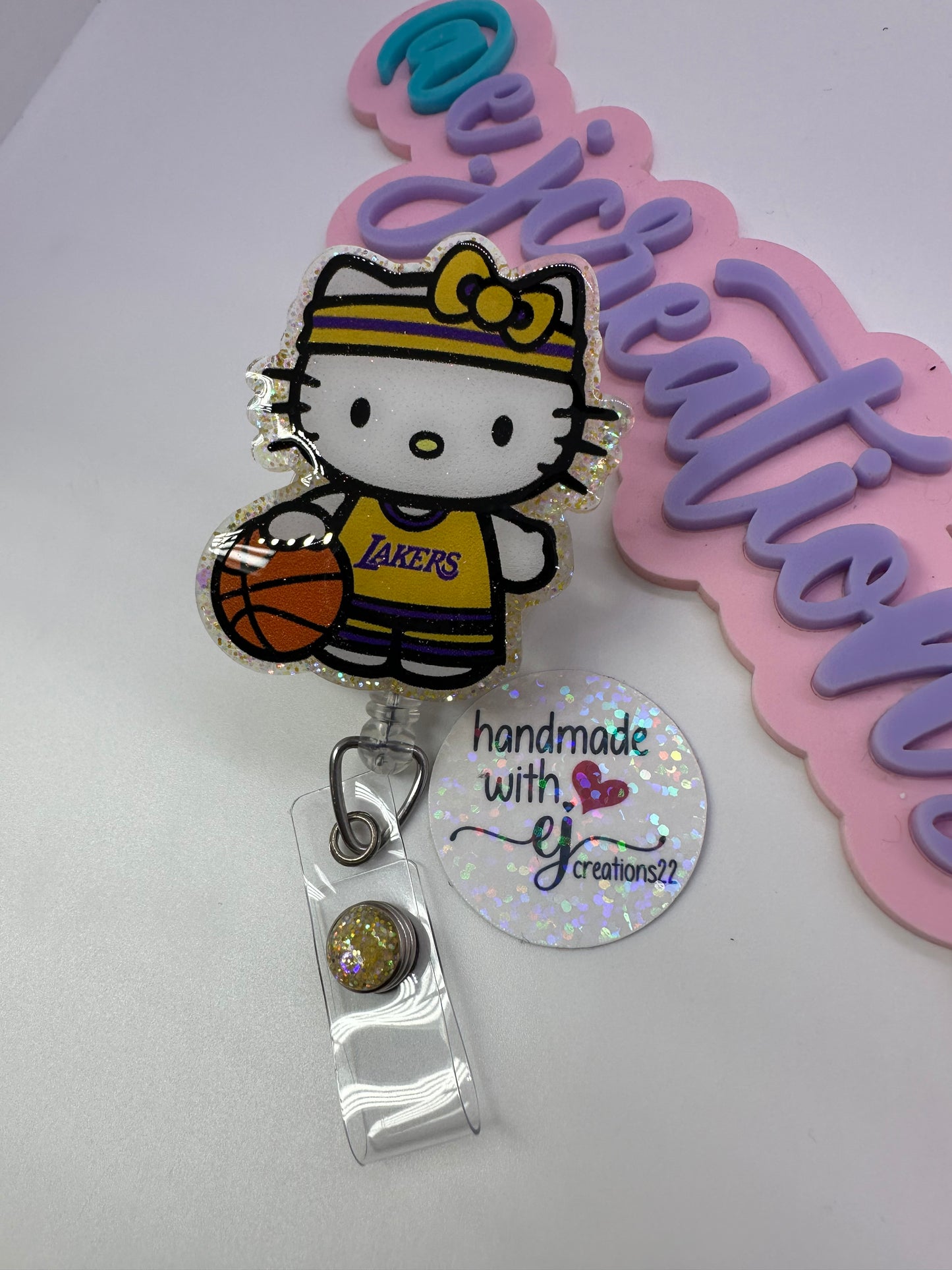 Kitty Basketball Purple & Gold Badge Reel