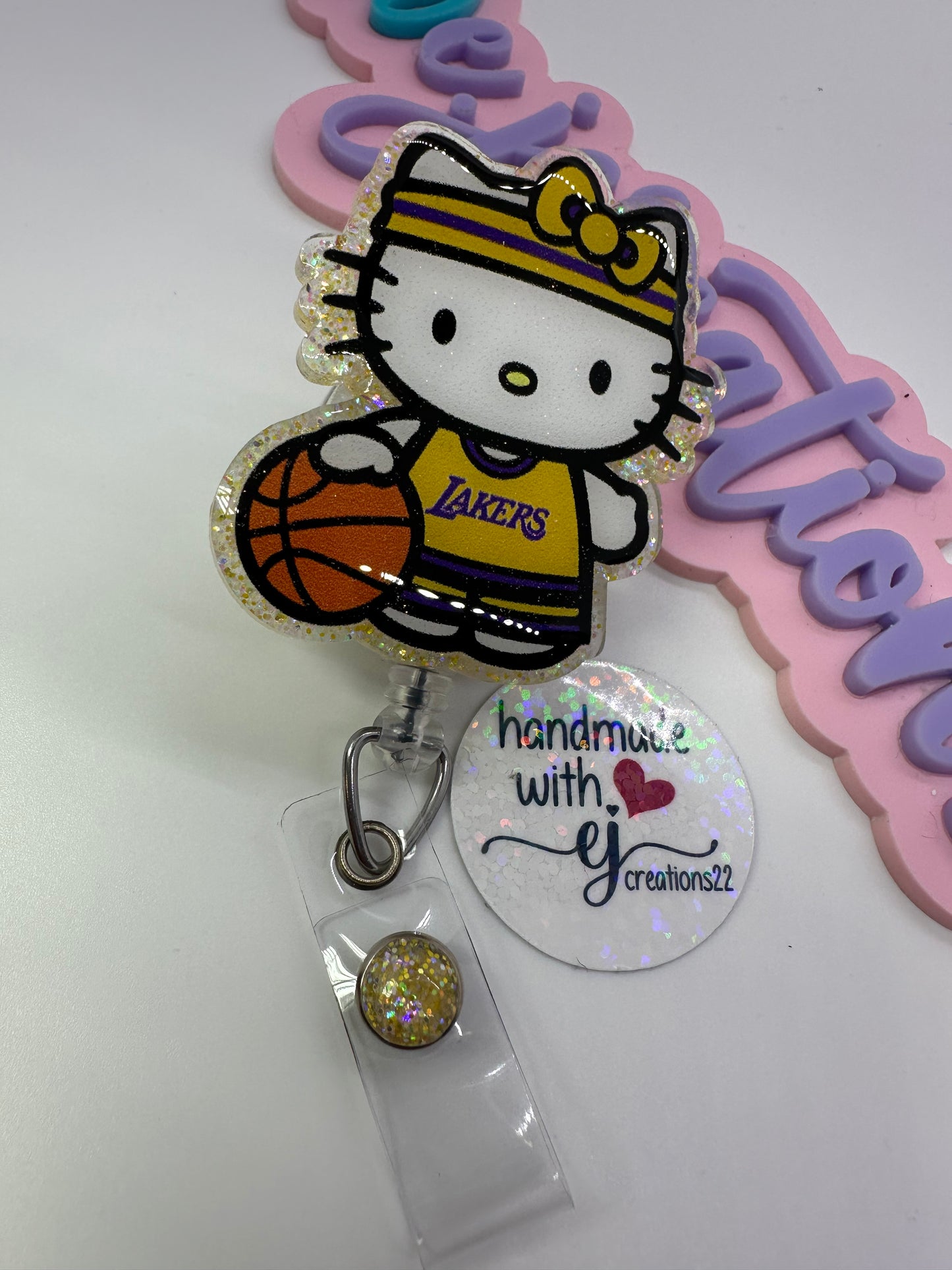 Kitty Basketball Purple & Gold Badge Reel