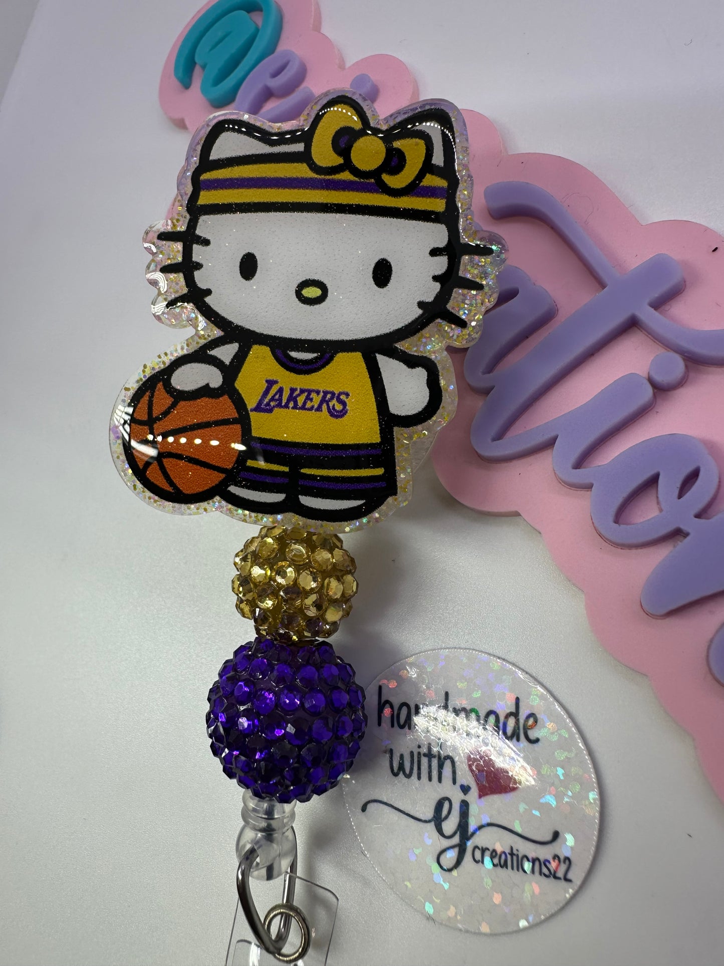 Kitty Basketball Purple & Gold Badge Reel