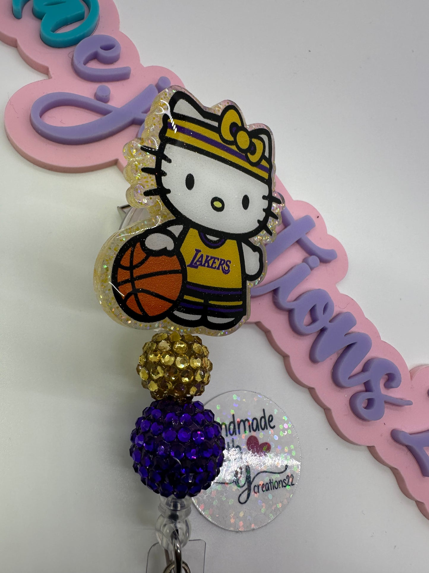 Kitty Basketball Purple & Gold Badge Reel