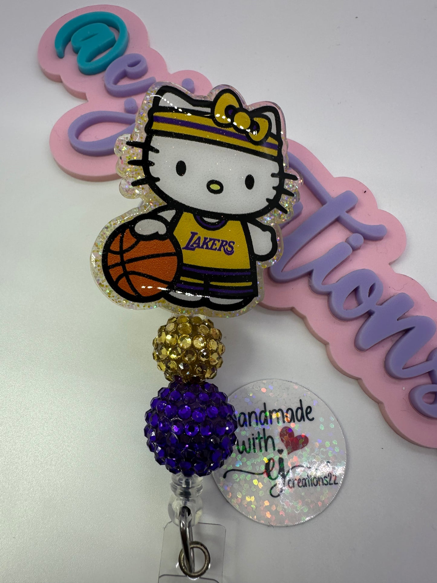 Kitty Basketball Purple & Gold Badge Reel