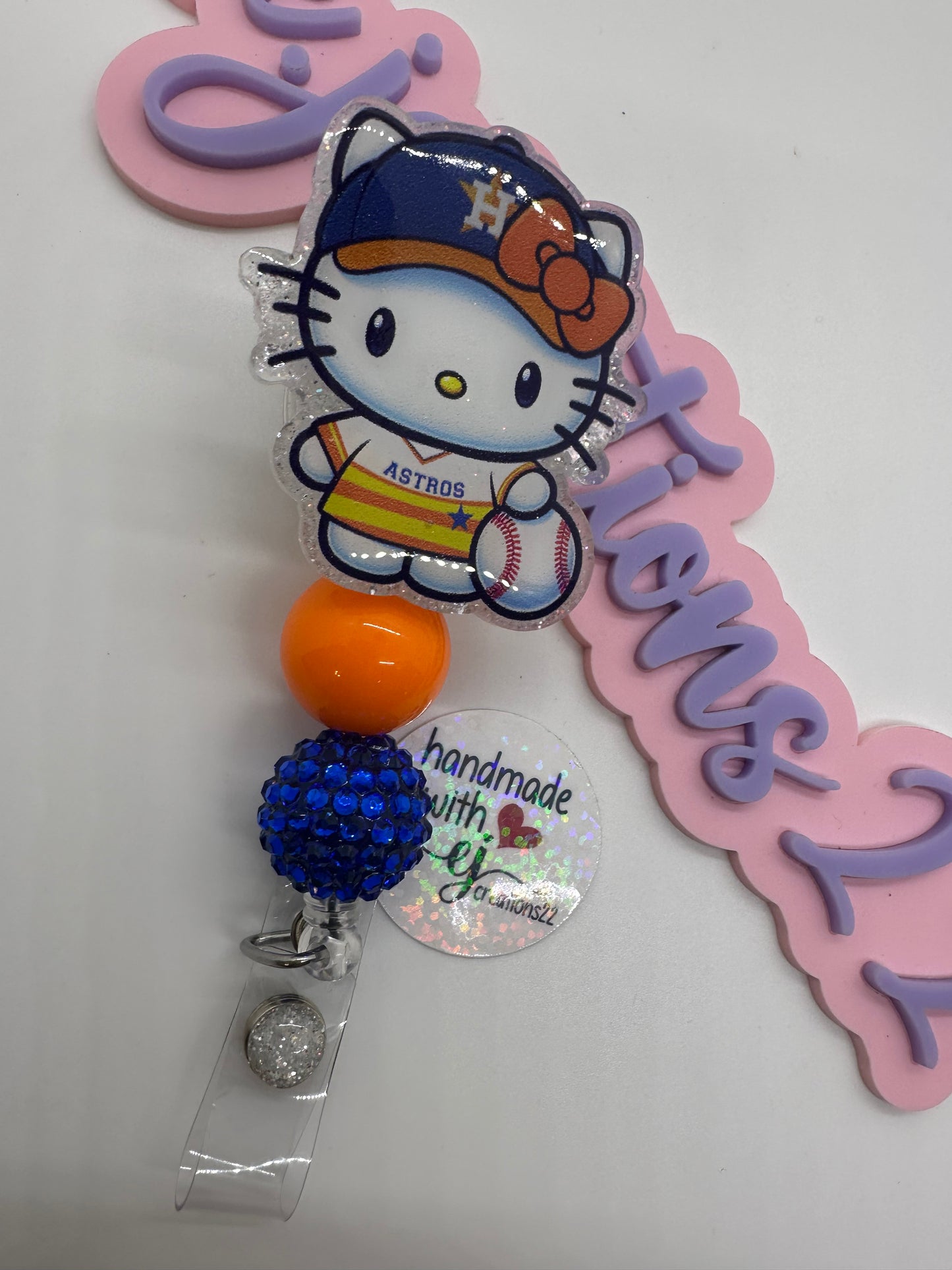 Kitty Orange and White sports Badge Reel