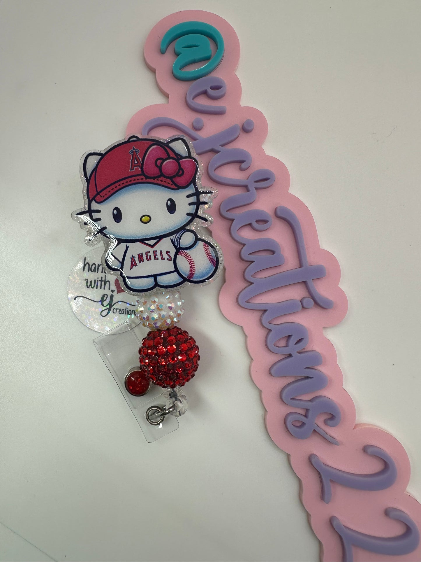 Kitty Red and White Badge Reel