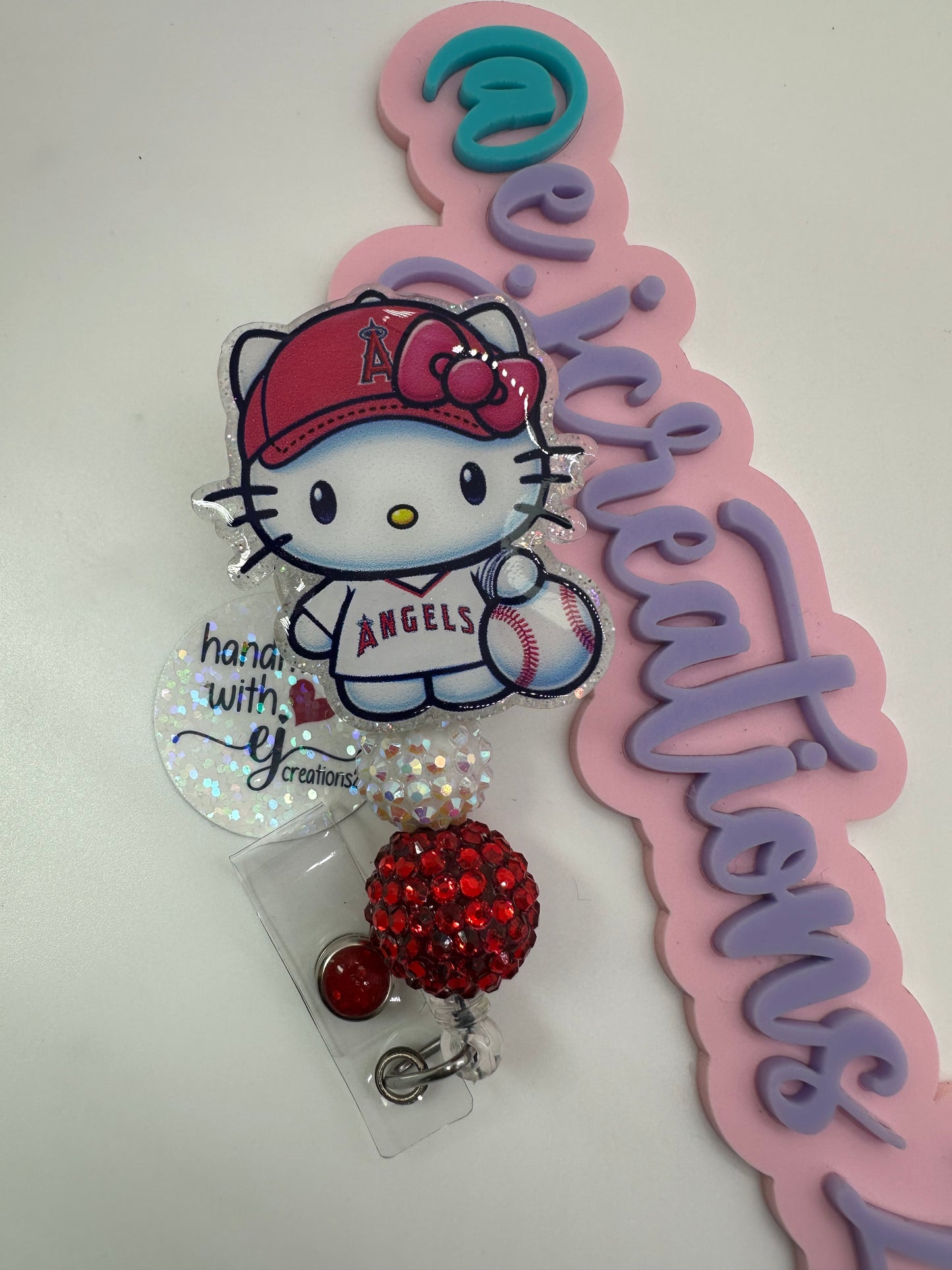 Kitty Red and White Badge Reel