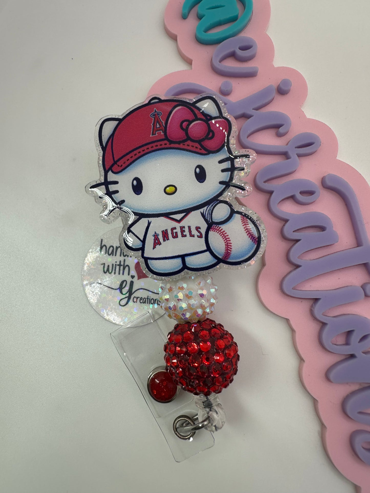 Kitty Red and White Badge Reel