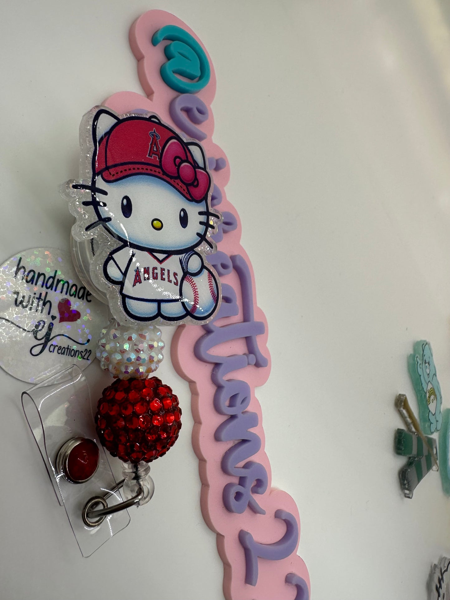 Kitty Red and White Badge Reel