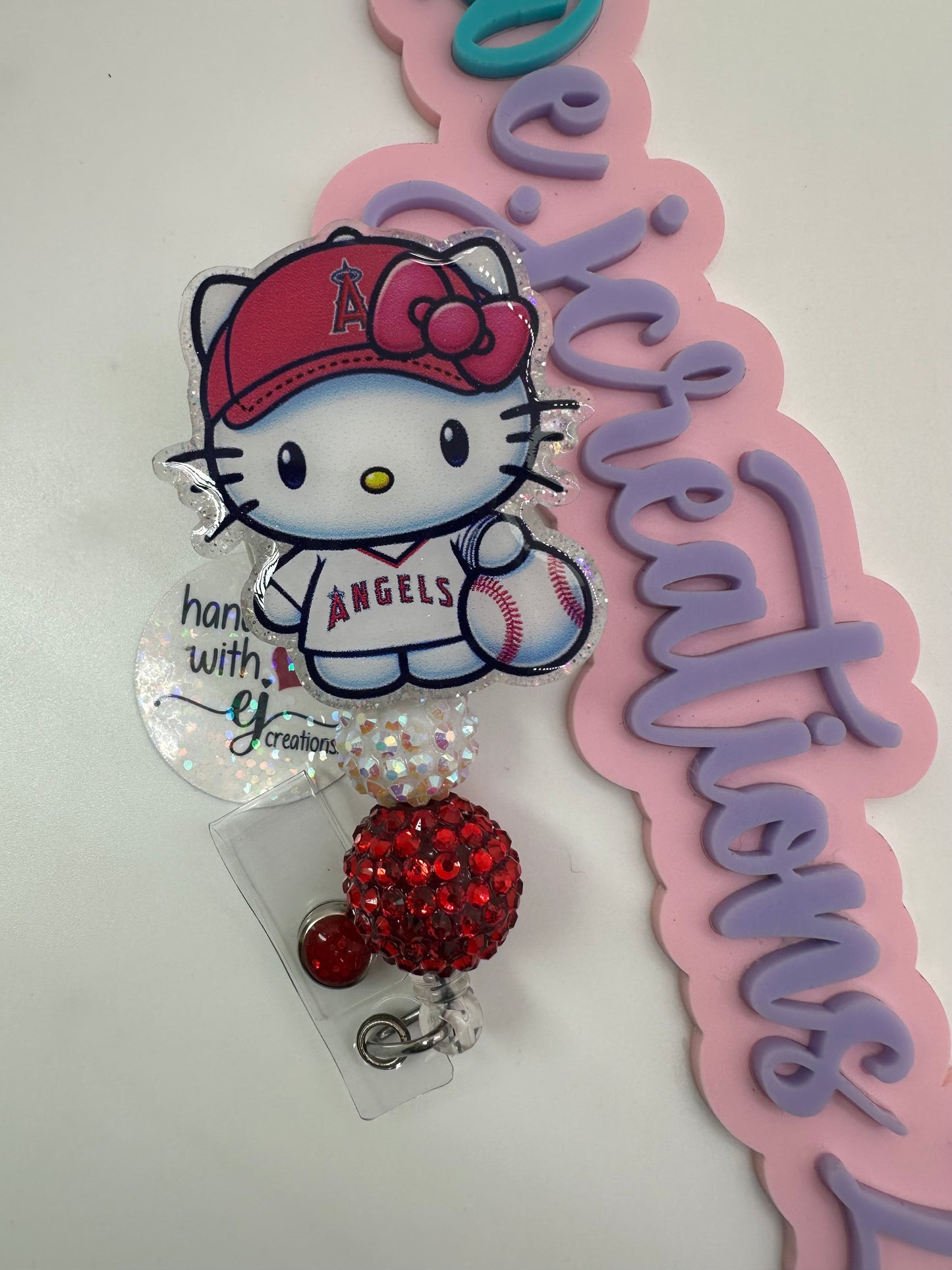 Kitty Red and White Badge Reel