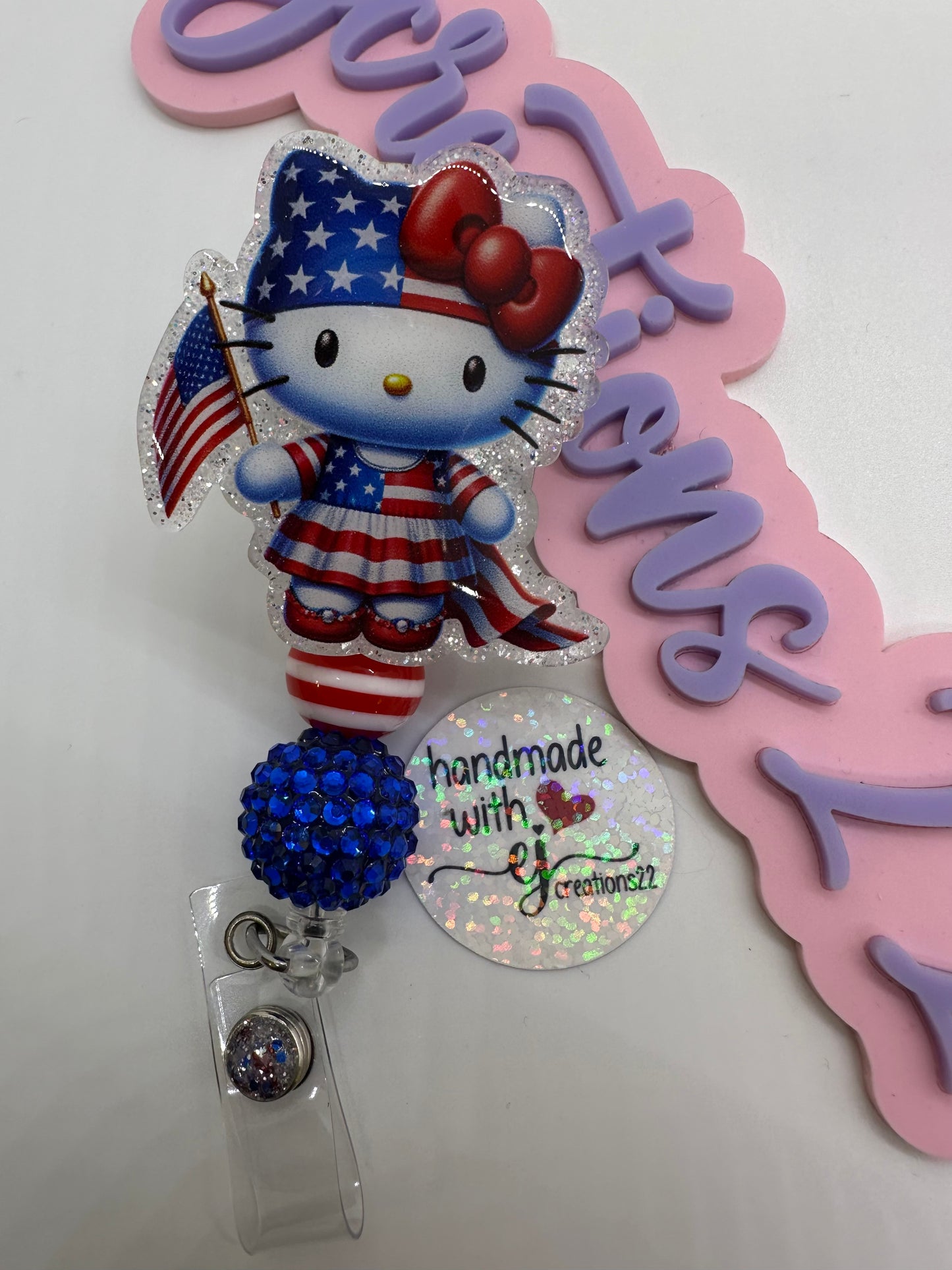 Kitty Red White and Blue Badge Reel