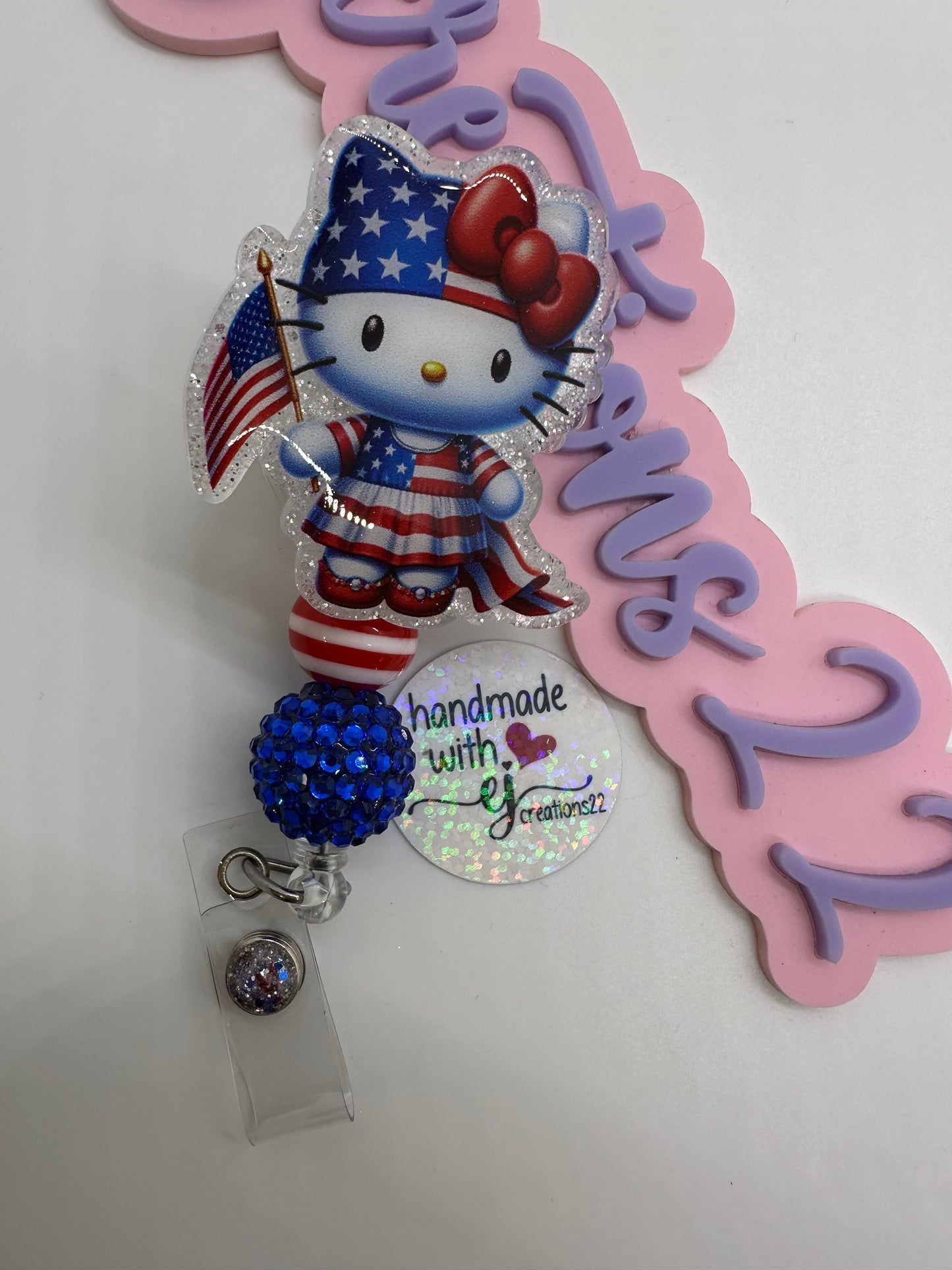 Kitty Red White and Blue Badge Reel