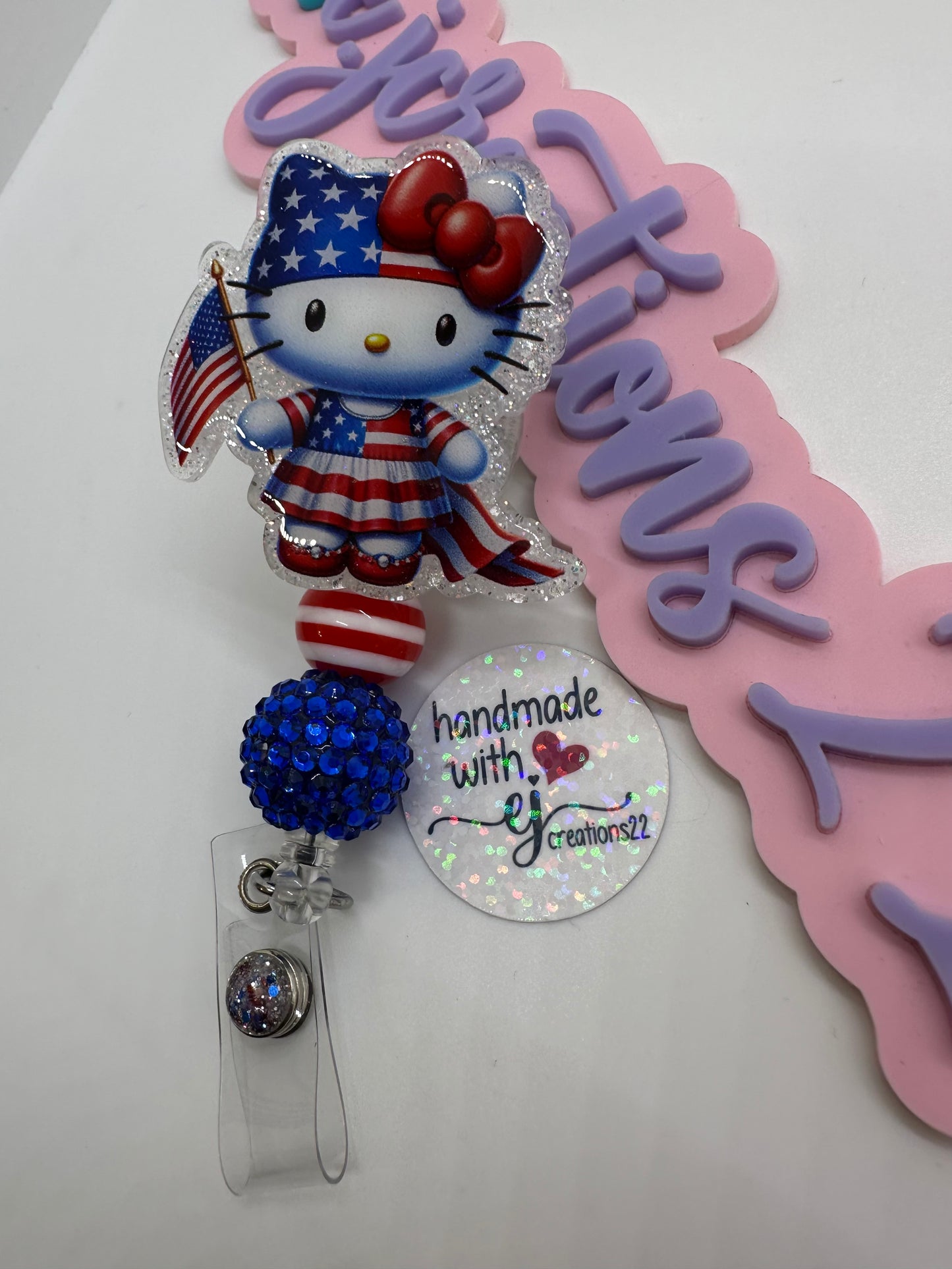 Kitty Red White and Blue Badge Reel