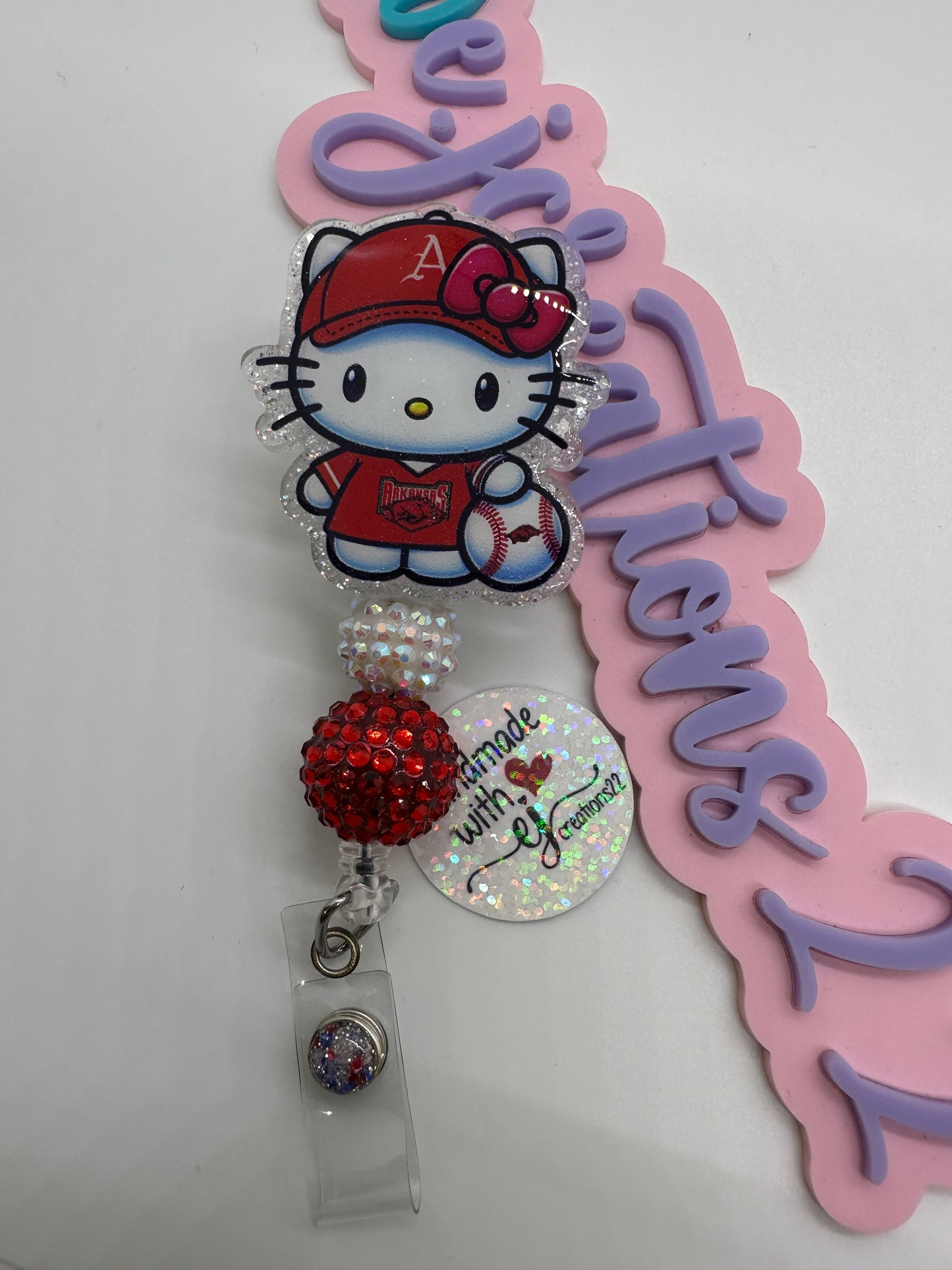 Kitty Razor Badge Reel