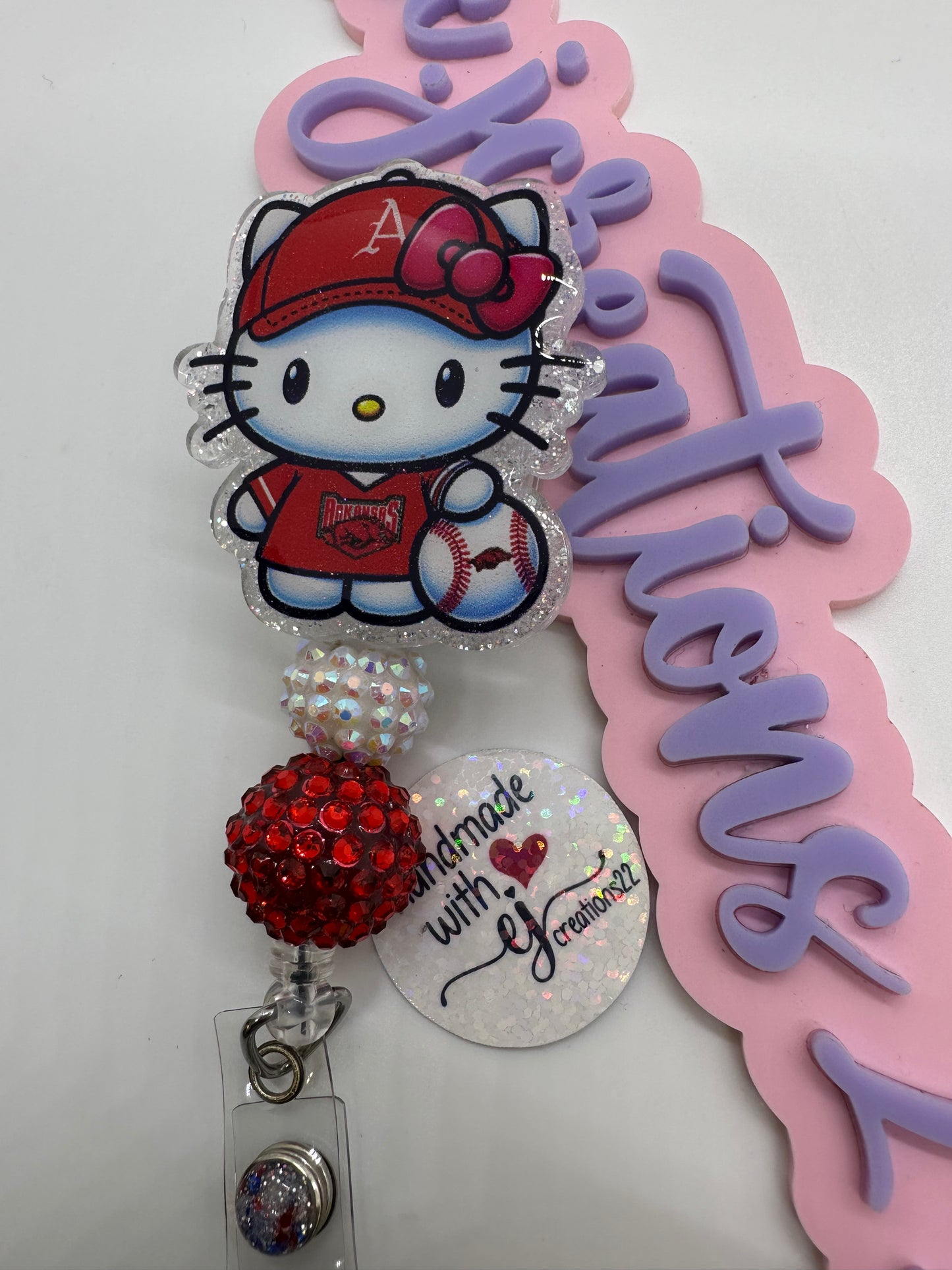 Kitty Razor Badge Reel