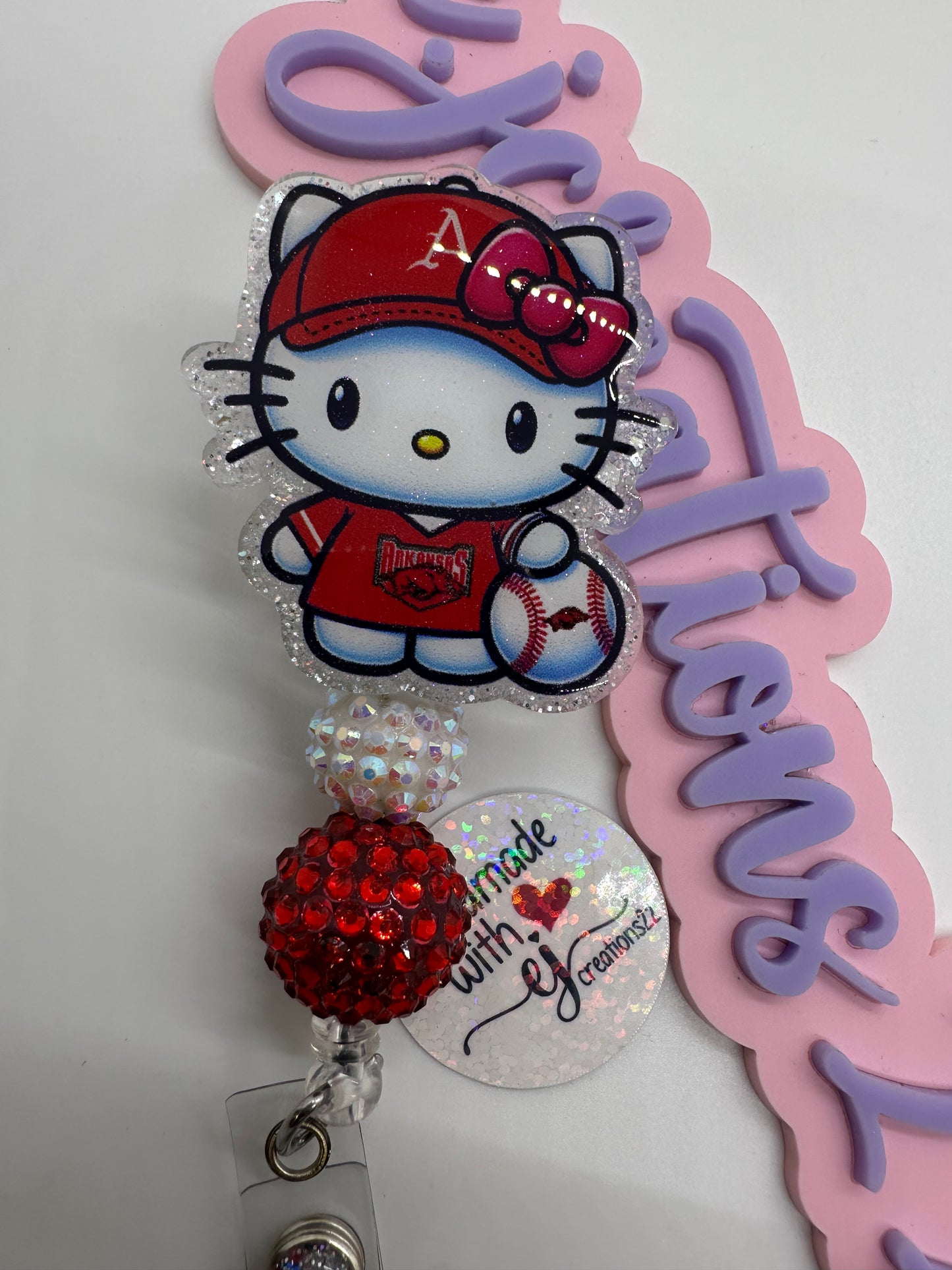 Kitty Razor Badge Reel