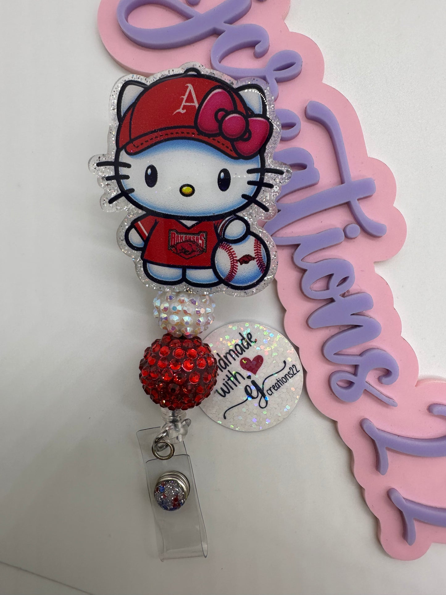 Kitty Razor Badge Reel