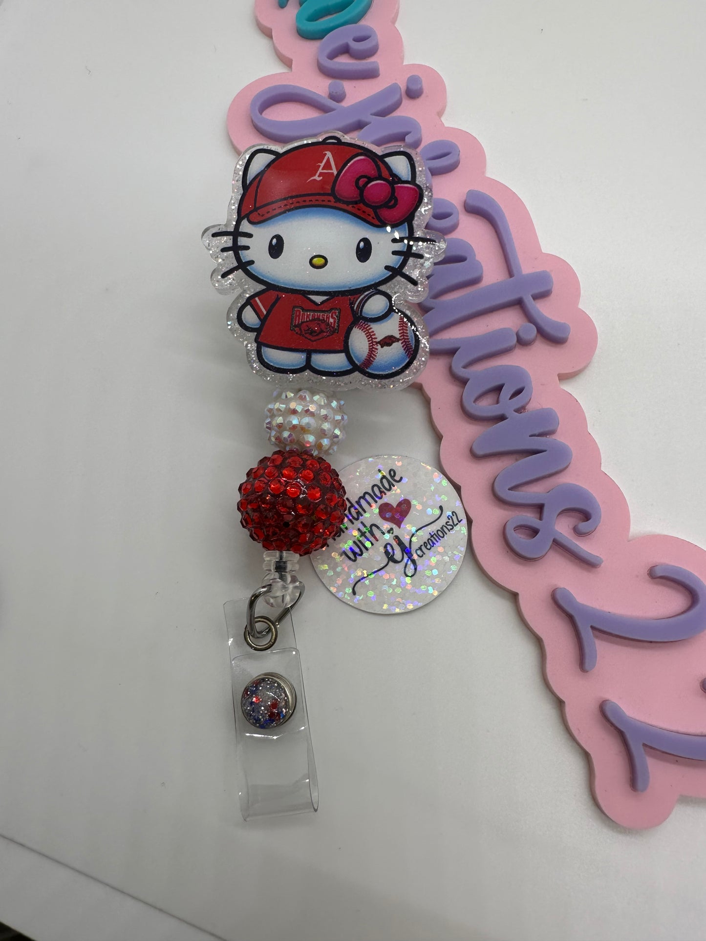 Kitty Razor Badge Reel