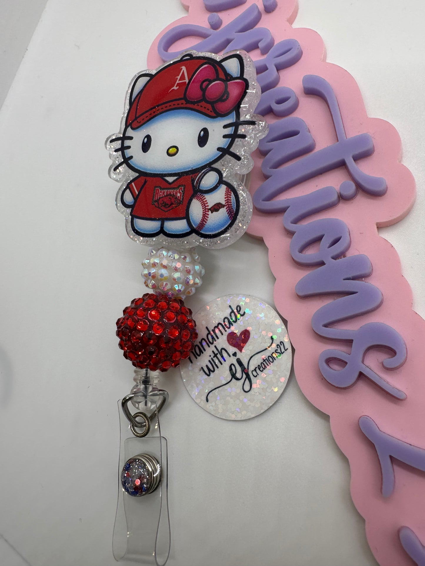 Kitty Razor Badge Reel